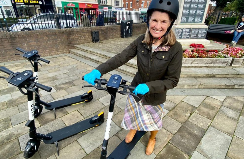 Rachel on an e-scooter