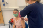 Rachel receiving her COVID vaccination.